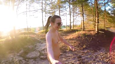 Petite 18yo tourist gets inked on Latvian nudist beach poses closeup