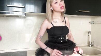 Blonde teen in stockings masturbates alone in her kitchen